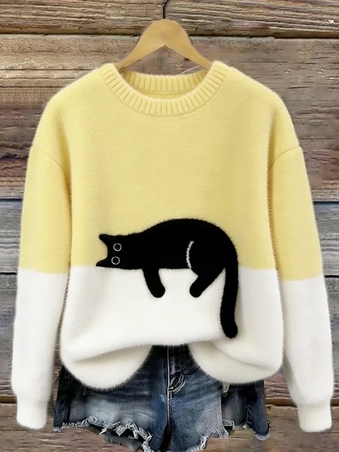 Jersey oversize amarillo y blanco con dibujo de gato negro
