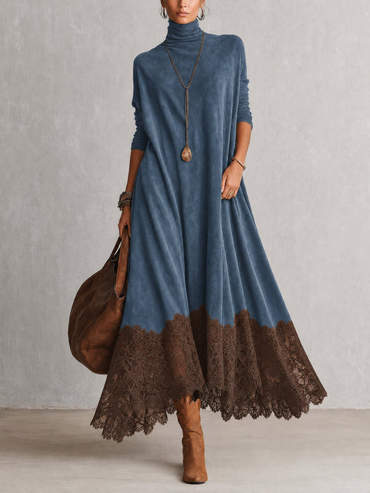 Vestido largo azul efecto ante, cuello alto, mangas largas y bajo de encaje marrón.