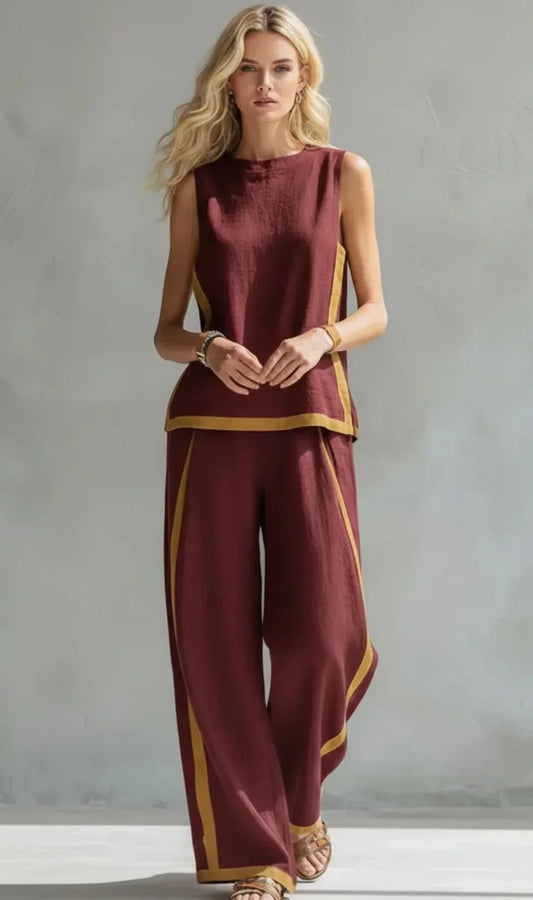 Conjunto de dos piezas burdeos: top sin mangas y pantalón ancho con franja amarilla.
