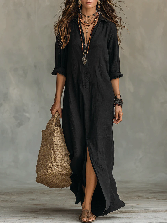 Vestido maxi fluido negro con botones, manga tres cuartos y abertura frontal