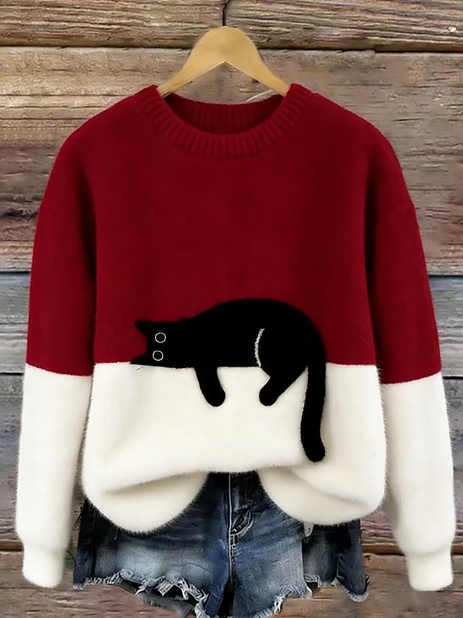 Jersey oversize rojo y blanco con dibujo de gato negro
