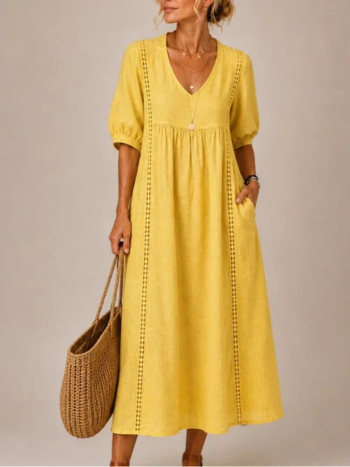 Vestido medio de verano amarillo con cuello en V y mangas abullonadas, bordado lateral