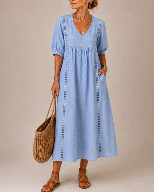 Vestido medio de verano azul con cuello en V, mangas abullonadas y bordado vertical