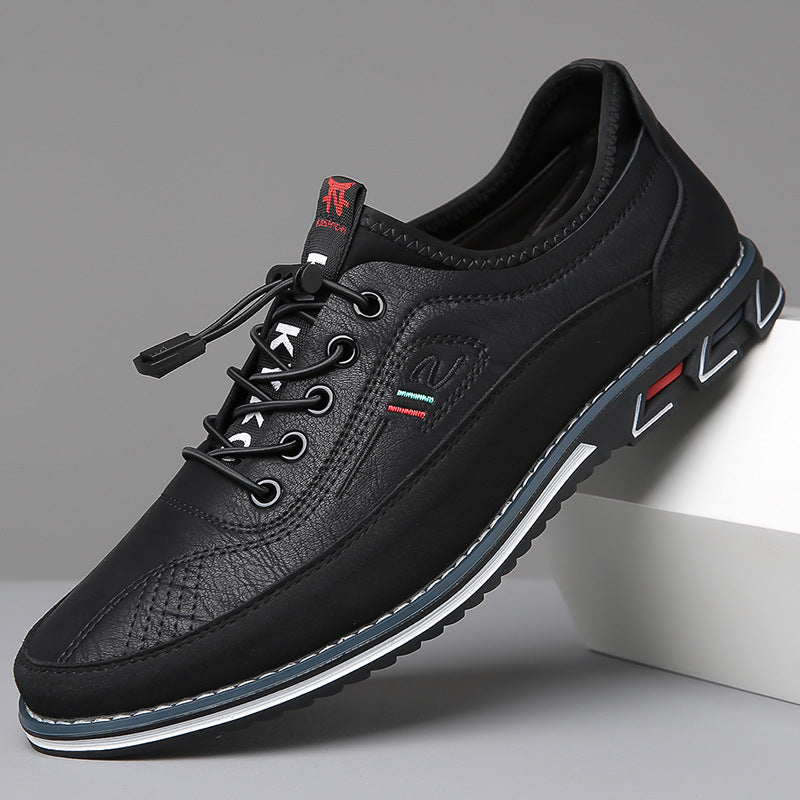 Zapato Oxford de piel negra con cordones, detalles rojos y suela con borde azul