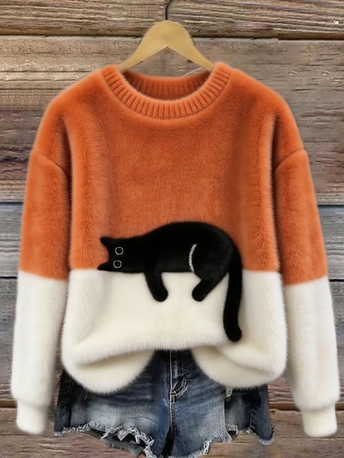 Jersey oversize naranja y blanco con dibujo de gato negro