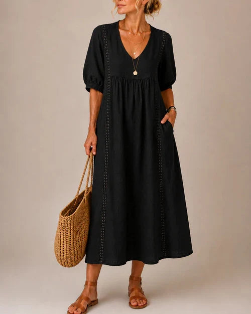 Vestido medio de verano negro con cuello en V, mangas abullonadas y bordado a lo largo