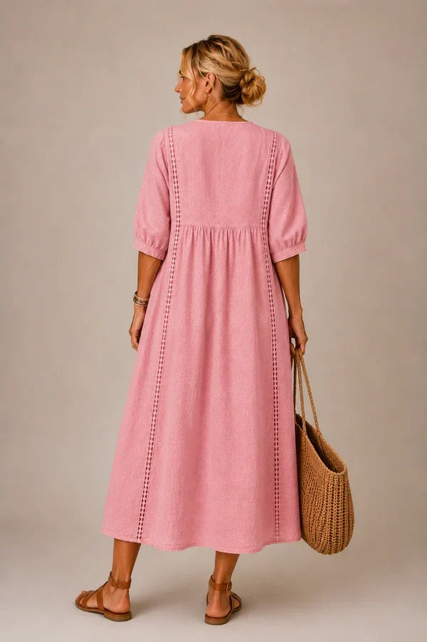 Vestido medio de verano rosa con mangas abullonadas y bordado en la parte trasera